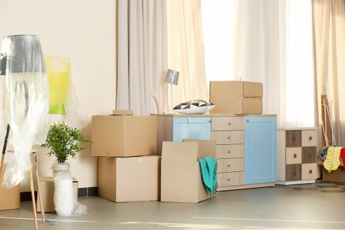 Student removals in Hackney with packed boxes and moving van