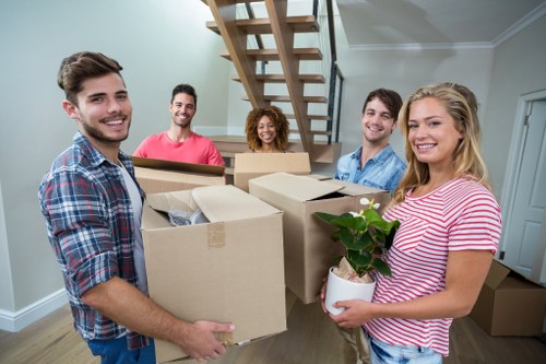 Professional removal team loading boxes in Hackney