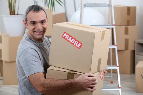 Man and van service loading household items into a vehicle