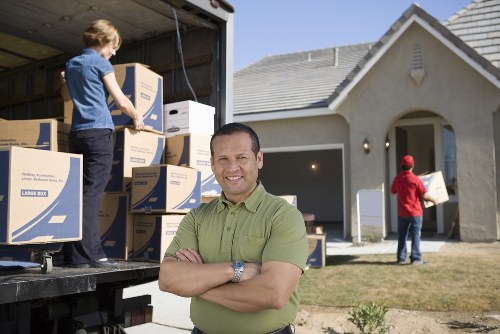 Professional movers loading furniture in Hackney